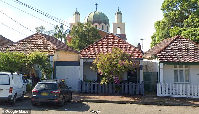 A street view image taken from further away from the house shows the church behind