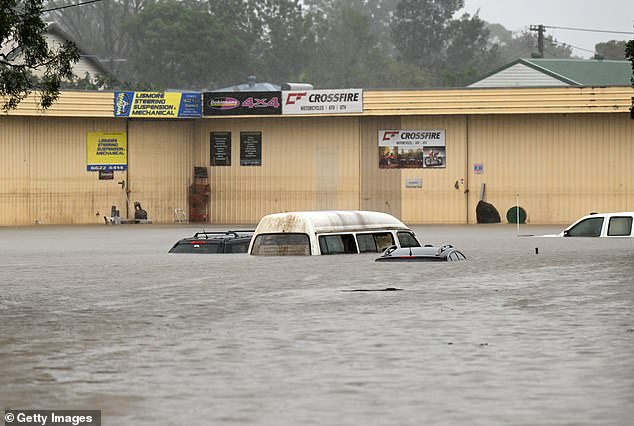Pictured: Floodwater inundate cars on March 30, 2022 in Lismore, Australia